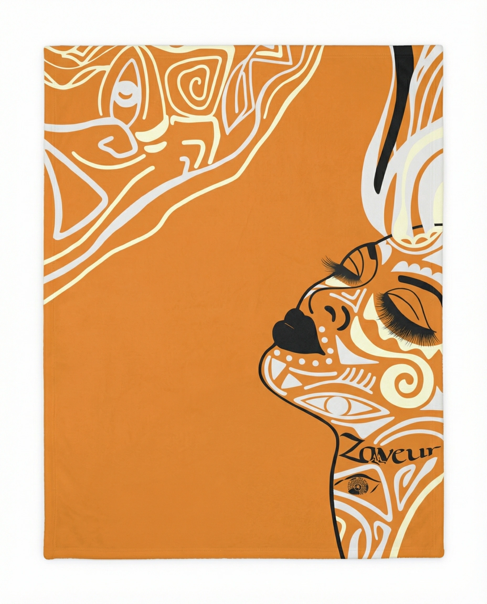 Orange throw blanket featuring a stylized abstract face illustration with flowing lines and modern artistic details