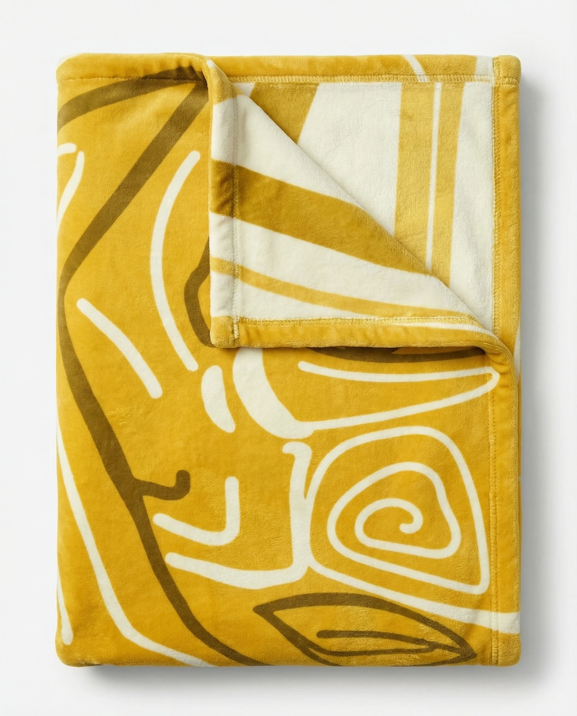 Folded reversible fleece blanket featuring a rich gold plush side and a white abstract line art pattern, highlighting softness, warmth, and premium quality