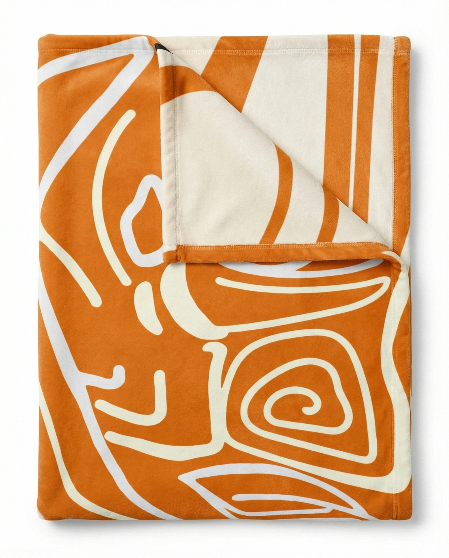 Folded reversible fleece blanket showing a vibrant orange abstract design on one side and a soft white reverse, emphasizing plush texture and premium finish