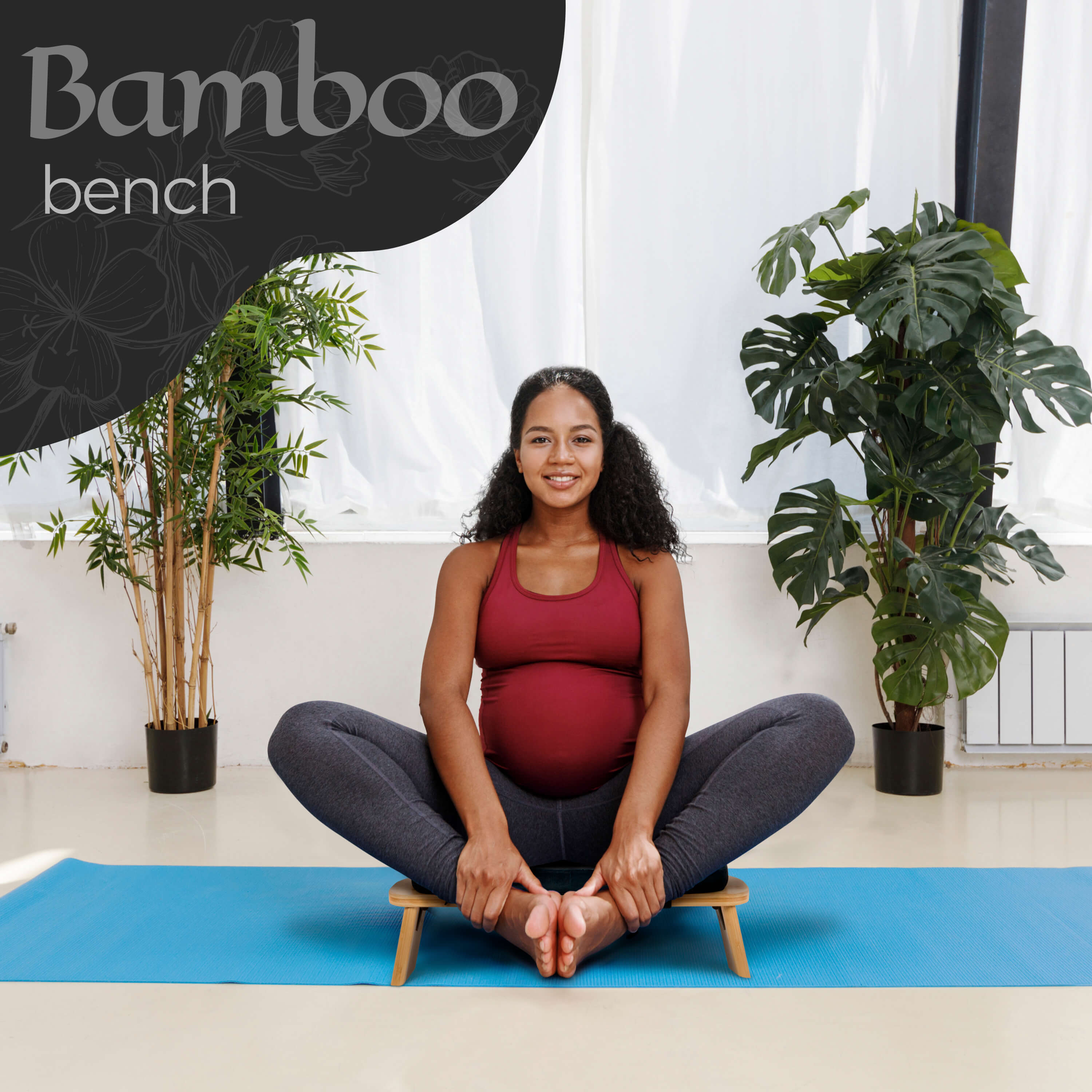 Woman sitting on a Bamboo Bench in a yoga pose with plants around.