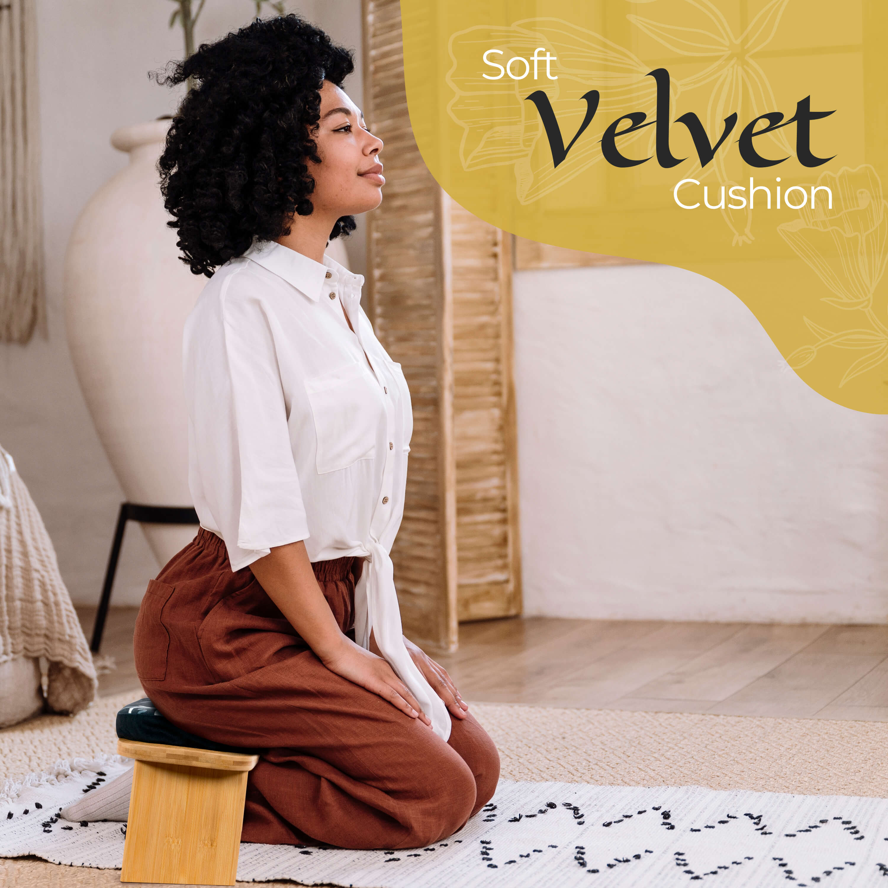 Woman sitting on a soft velvet cushion in a cozy room.