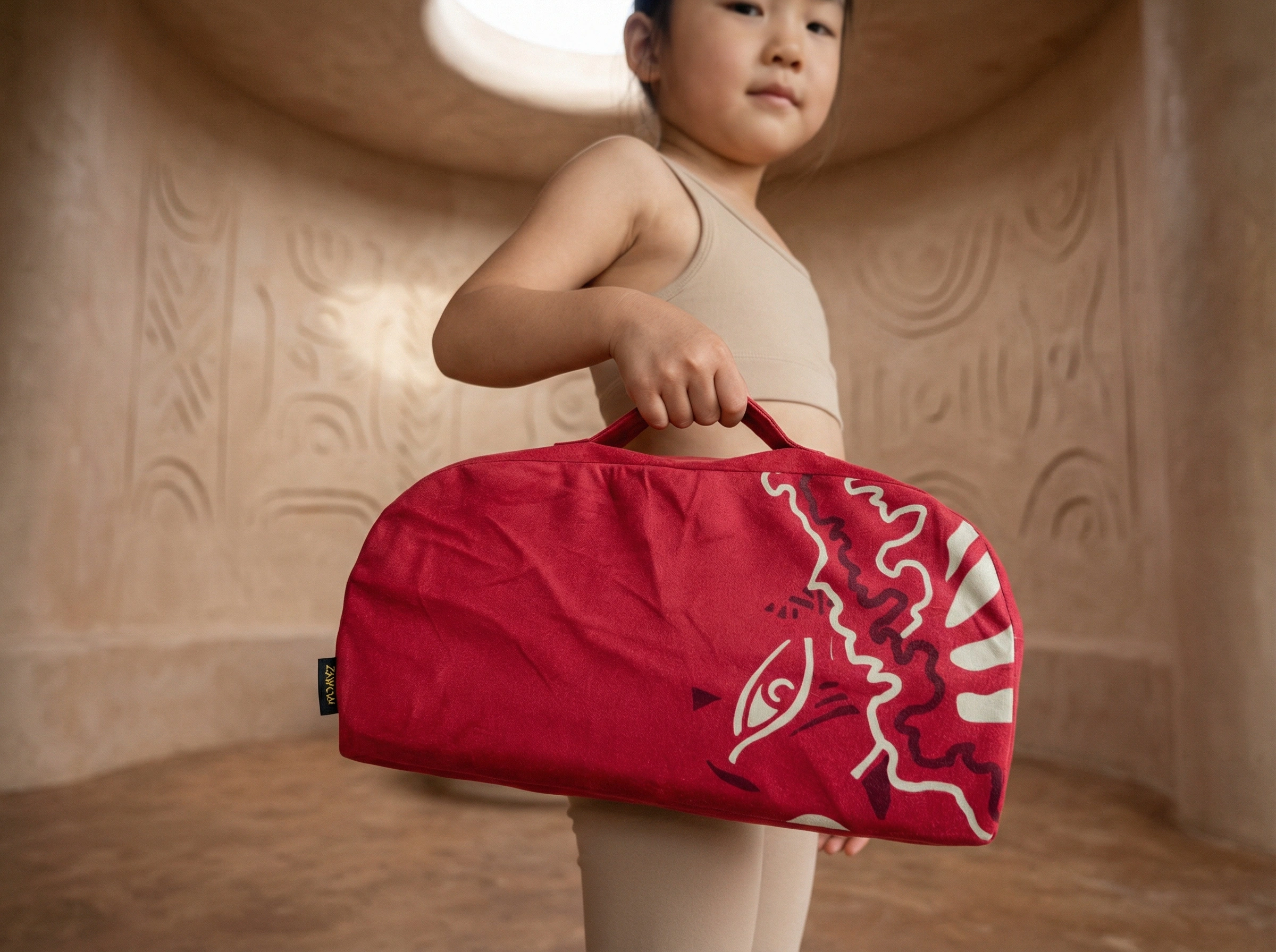 Lightweight red storage bag with handle for a meditation bench