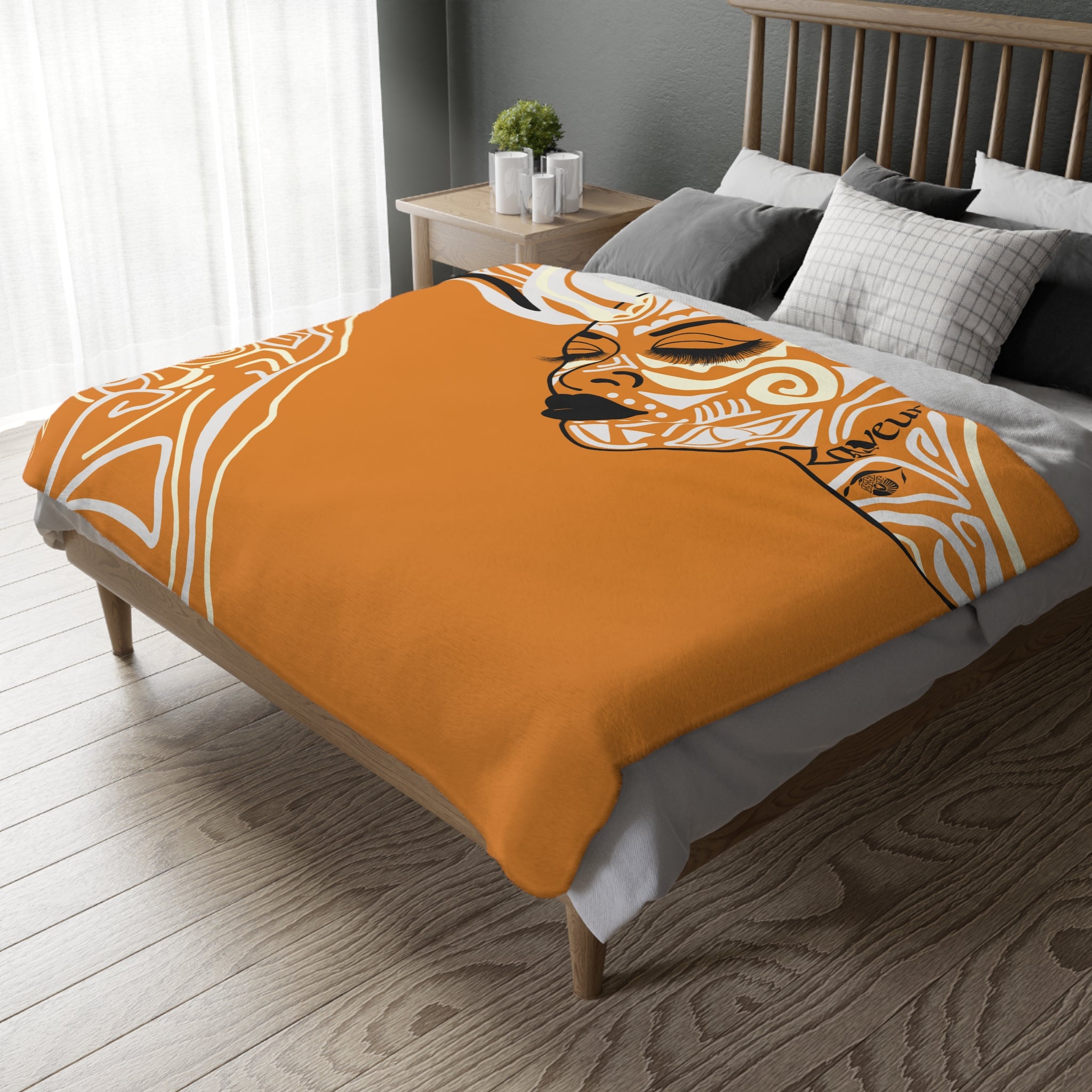 Modern orange abstract throw blanket designed as a stylish home decor accent with artistic swirl elements
