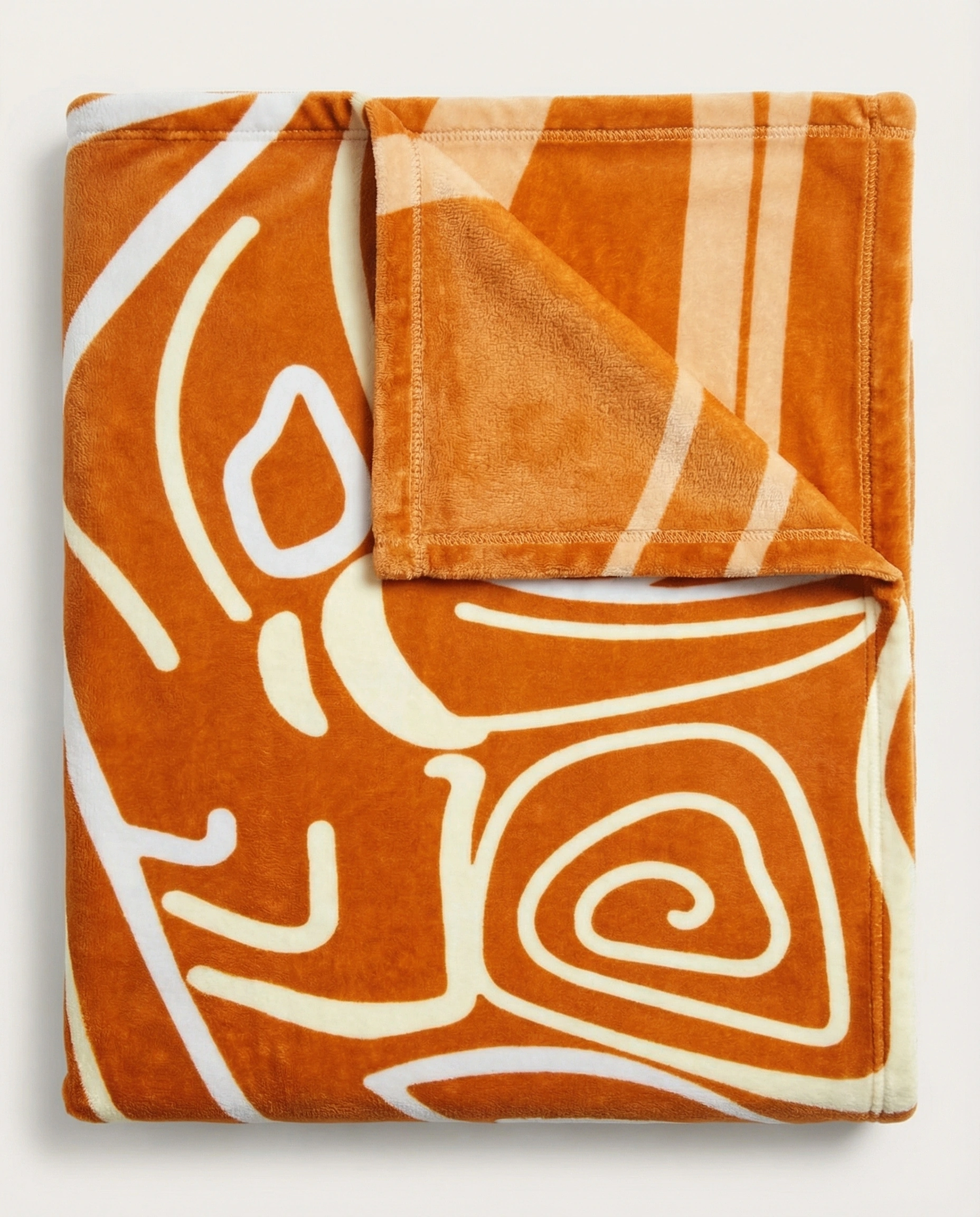 Close-up of orange abstract swirl pattern blanket with smooth curves and modern artistic style