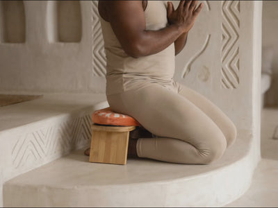 Lifestyle video showing a yoga meditation bench used for comfortable kneeling meditation and mindfulness practice