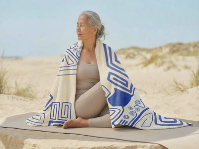 Person enjoying a peaceful outdoor lifestyle while using a geometric meditation blanket, showcasing calm movement, relaxation, and mindful living in a natural environment.
