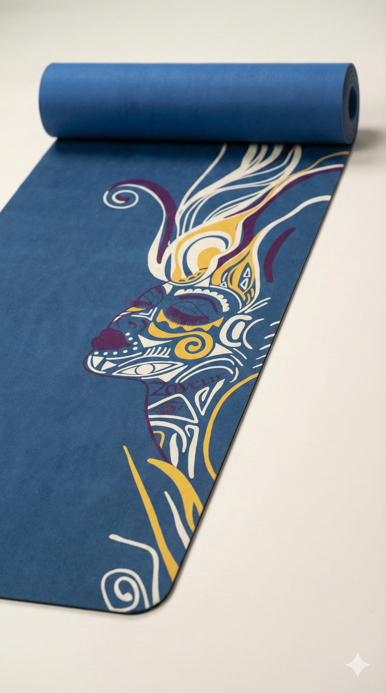 Zaveur blue yoga mat with artistic multicolor face illustration partially rolled on studio floor